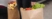 Close-up of a person carrying groceries